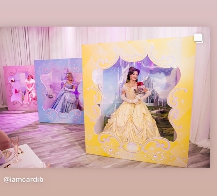 Belle, Cinderella, and Aurora posing at a celebrity birthday party