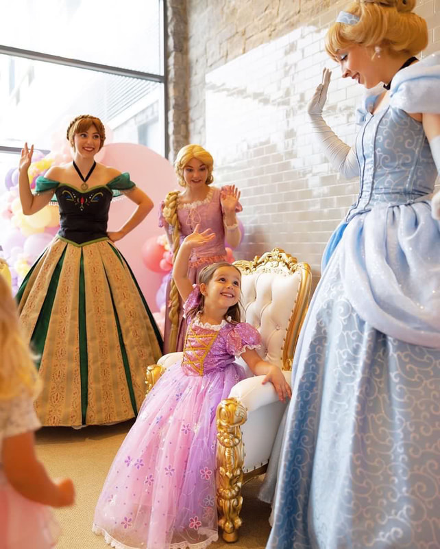 Cinderella, Rapunzel and Anna crown a little princess