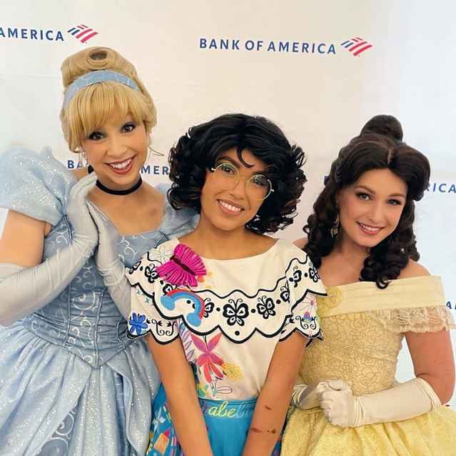 Cinderella, belle, and Maribel at a corporate party