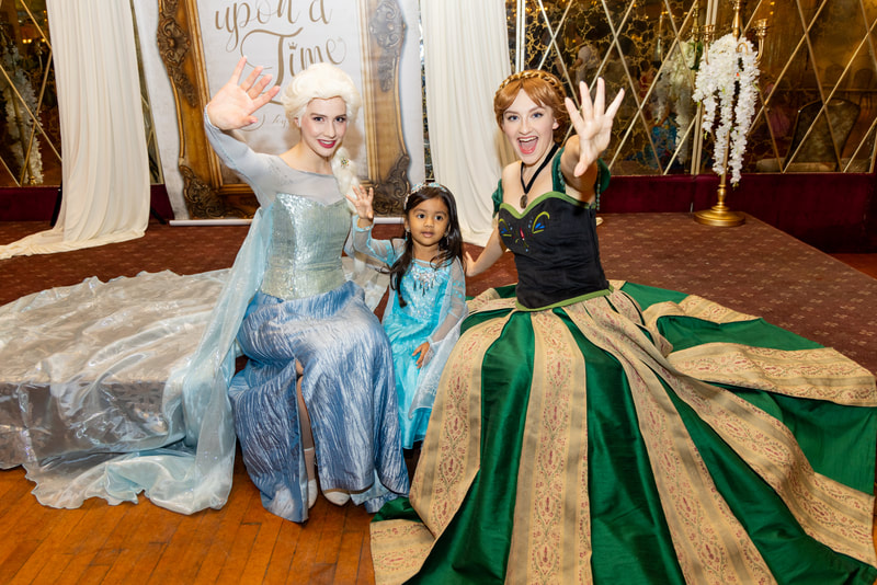 Elsa and Anna show off their ice powers at a kid's princess event in Astoria