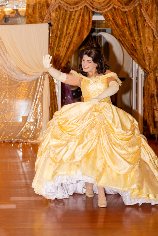 Princess Belle enters the ballroom at the Astoria Princess Ball 