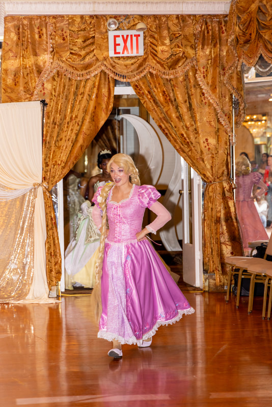 Rapunzel skips into the ballroom to begin the kid's princess activities