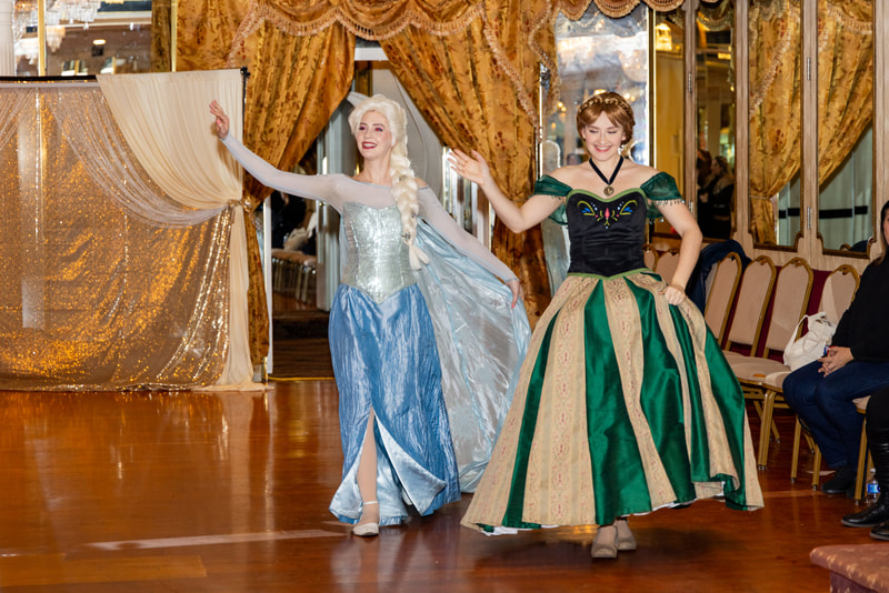 Elsa and Anna have a grand entrance at the royal princess event in Astoria