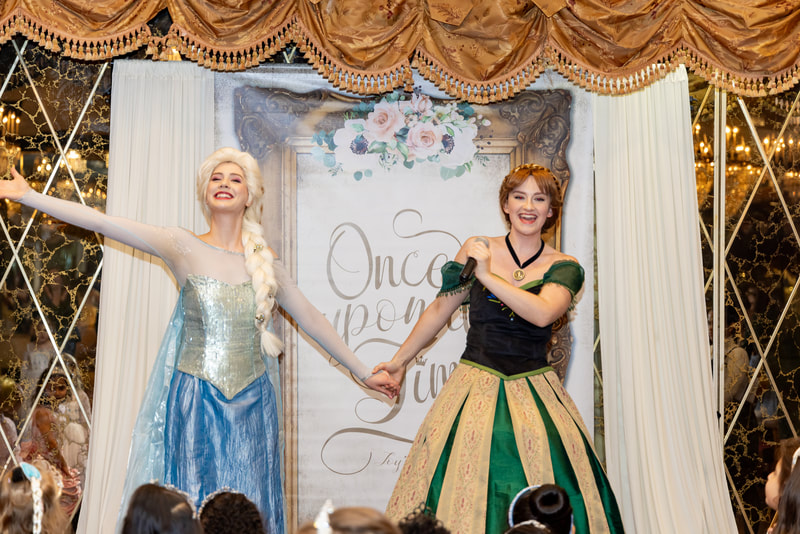 Elsa and Anna put on a frozen party