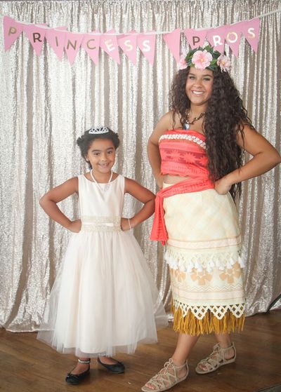Moana and a little princess smile together