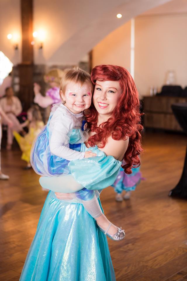 Ariel and a child pose together in NYC