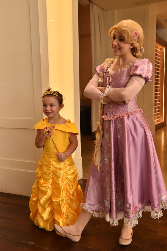 Princess Rapunzel and a little Belle pose for photos nyc event